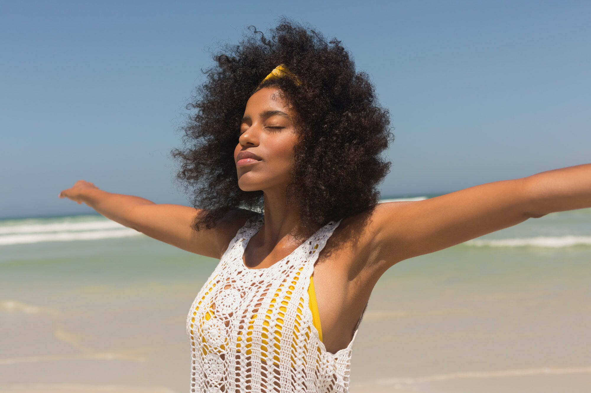 Misfit Entrepreneur™ enjoying the beach after she implemented strategies to vacation-proof her brand